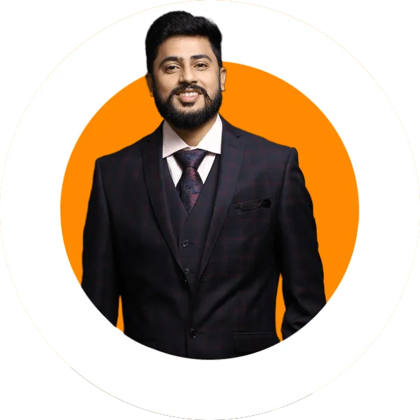 Dr. Jay Sarraf smiling in a dark suit and tie against an orange circular background